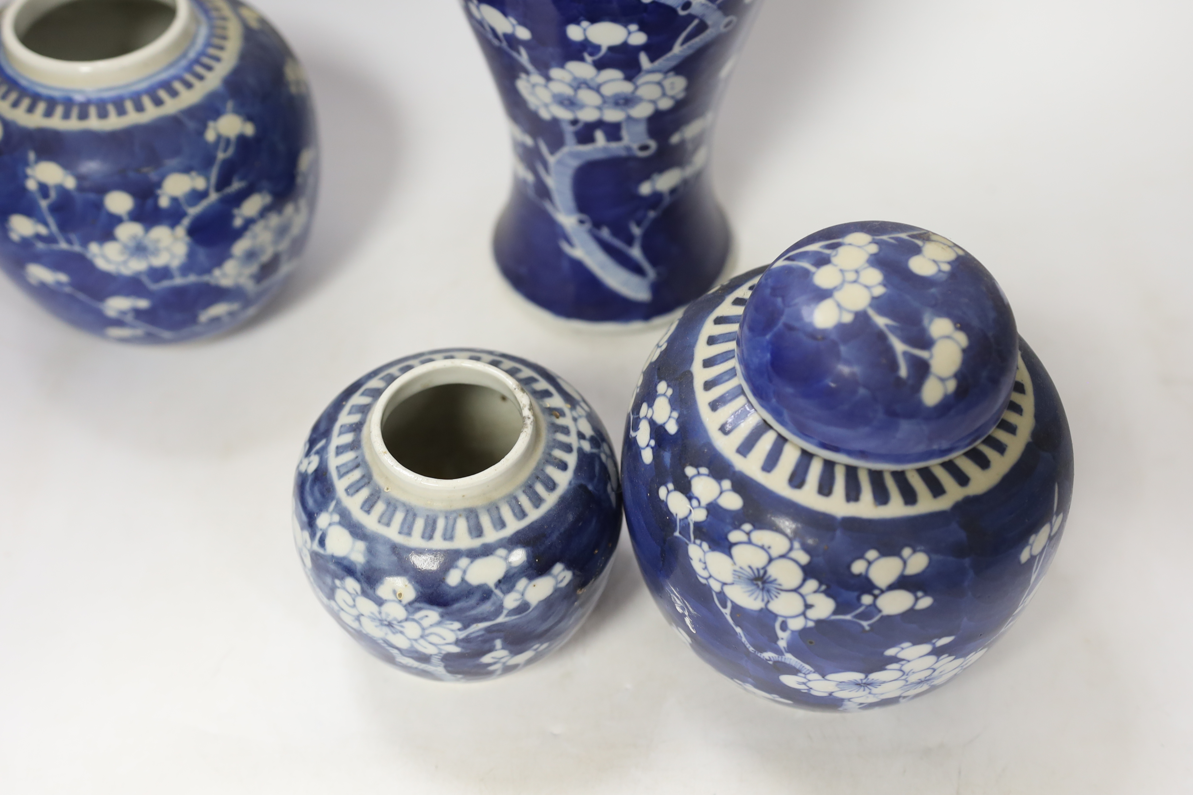 Three early 20th century Chinese blue and white jars (one with cover) and a similar vase and cover (a.f.), tallest 37cm